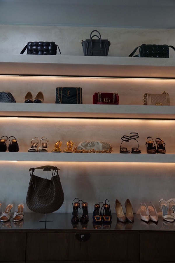 Designer handbags and heels on the showroom shelves