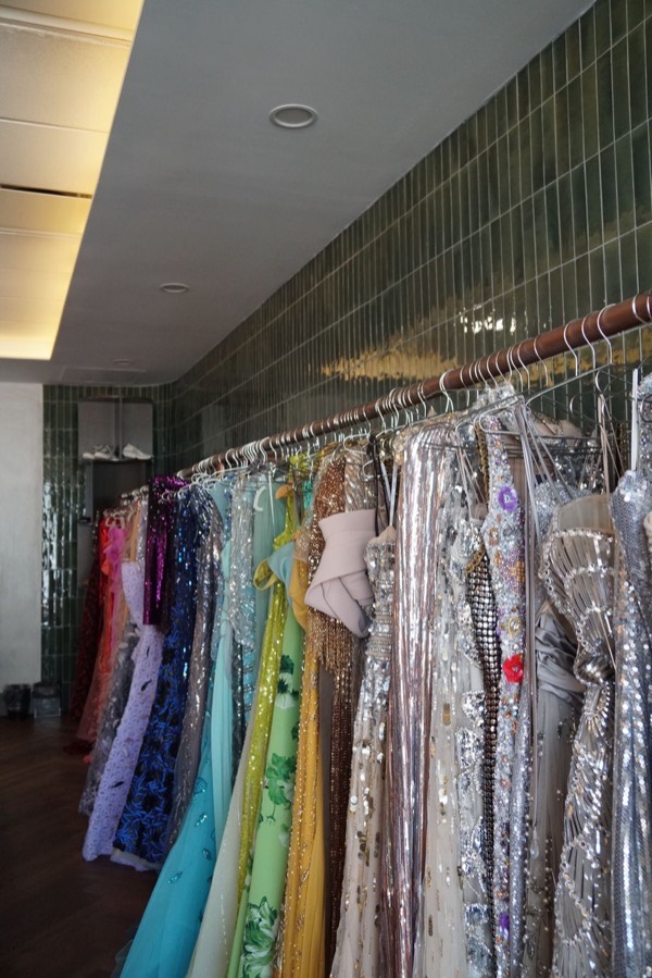 Rail of embellished evening gowns